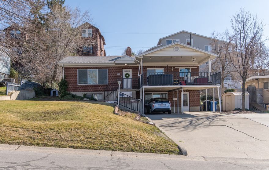 AMAZING VIEWS!!  Perfect indoor/outdoor living on the spacious deck with access right from the kitchen. There's a hottub on the deck so you can truly soak in the views. The main floor has 2 bedroom 2 bath with a kitchen, family room, laundry, two-sided fireplace, and an exit to a spacious backyard.  The basement features a fully functional ADU that was completely remodeled in 2018, with its own kitchen, laundry, two bathrooms and a separate entrance, providing an ideal setup for rental income, a home office, or guest quarters. Two-car carport with an RV parking pad and quick access to Big and Little Cottonwood Canyons, all while enjoying panoramic city lights and sunsets from the comfort of the main living areas.   Square footage figures are provided as a courtesy estimate only and were obtained from MLS.  Buyer is advised to obtain an independent measurement.