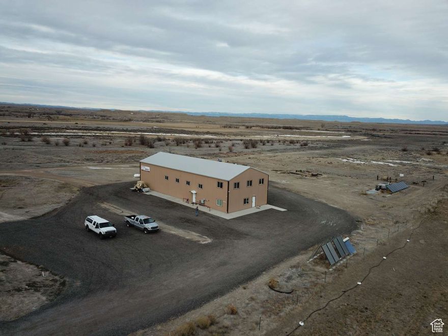 FOR SALE 4,000 sqft Commercial/Industrial Facility on 4 Acres Property Highlights 4,000 sqft total space:  3,200 sqft shop width 2127 clear span  800 sqft enclosed office  800 sqft mezzanine (pre-plumbed for second restroom or living space) Built in 2012 with industrial/residential zoning In-floor radiant heating (propane, dual zone) Solar power system with Victron inverters City water and sewer hookups 14 H  20 W service door and loading dock Bridge crane-ready structure (4-ton capacity) Land & Expansion Situated on 4 acres of flat, usable land  Ample space for outdoor storage, equipment parking, or expansion Ideal Uses Shop, Light manufacturing or fabrication, Contractor headquarters, Equipment storage and repair