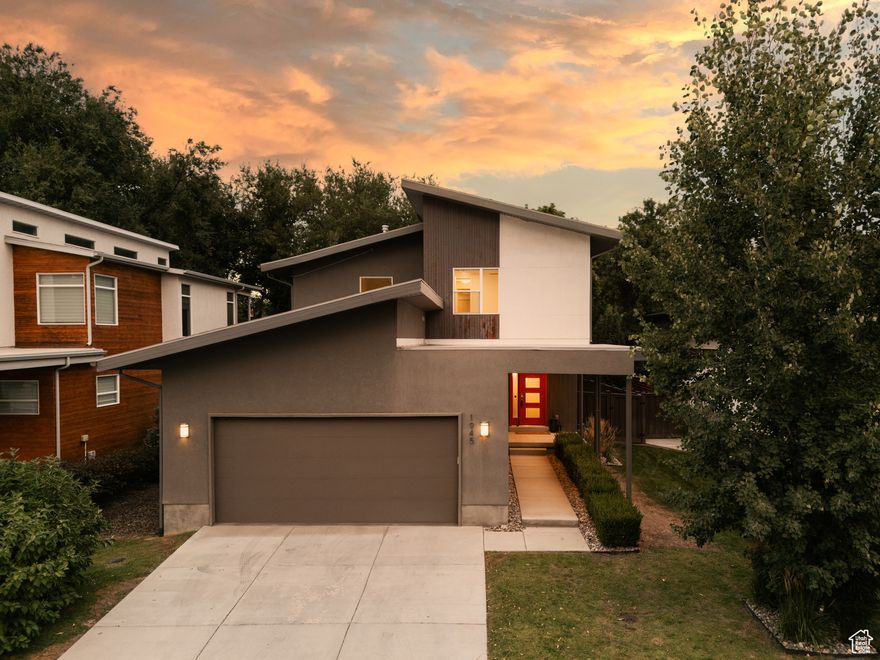 Set on a quiet circle in one of Holladay's most established neighborhoods, this modern two-story combines clean architecture with the kind of location buyers dream about. Built in 2017, it is rare to find newer construction in this part of town, especially one that feels this inviting, functional, and easy to live in. Step inside and you will notice how naturally the spaces connect. The main level is open and bright, designed for both gathering and everyday living. The gourmet kitchen anchors the home with a sleek island, double ovens, and high-end appliances, all opening to a great room framed by oversized windows. It is the kind of space that works just as well for hosting a full dinner party as it does for working on your laptop with a bagel from Rich's or a cut from Snyder's Butcher Shop nearby. Upstairs, the bedrooms are oversized with tall ceilings and plenty of light. The primary suite is a retreat with a spa-inspired bath, soaking tub, European shower, and a custom walk-in closet. The other bedrooms offer enough size and versatility to double as a home office, lounge, or creative space. The basement adds a whole new dimension to the home. Outfitted with a full kitchen and entertainment area, it is perfect for guests, game nights, or creating a wellness retreat with space for a gym or sauna setup. The outdoor living is just as comfortable. A covered deck overlooks the private backyard, spacious enough for gatherings yet simple to maintain. And then there is the location. Minutes from Holladay Quarter, local favorites like Rich's Bagels and Snyder's Butcher Shop, and only a short drive to Xcel Fitness or Cottonwood Country Club. With quick access to I-215, you are within 30 minutes of world-class skiing and year-round outdoor recreation. This is the rare Holladay home that brings together modern design, thoughtful function, and a lifestyle that balances ease with inspiration.