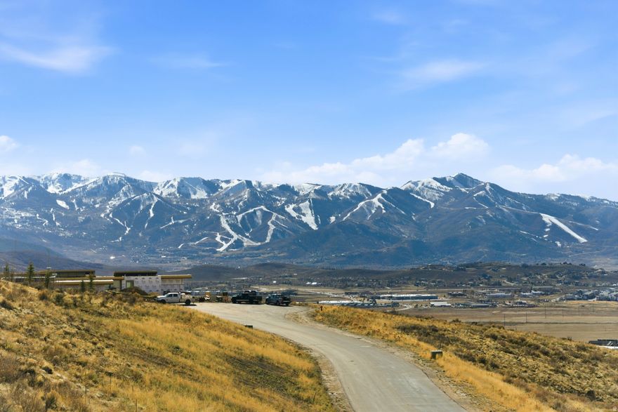 Coveted Elk Ridge Bluffs Homesite -- Positioned along one of the most coveted streets within Promontory Club, this exceptional homesite on Bugle Trail presents a rare opportunity to capture sweeping views of the Wasatch Back, including the iconic ski runs of Park City Mountain. Located in a more recently released enclave within Promontory Club, this homesite is framed by striking new construction and architecturally significant homes, creating an elevated setting defined by design and privacy. Encompassing over 1.5 acres, the homesite features a generous building envelope that allows for thoughtful design flexibility. The natural terrain lends itself beautifully to a multi-level mountain retreat, with ample space to create seamless indoor-outdoor living environments that embrace the surrounding landscape and expansive vistas. Ideally oriented to take full advantage of panoramic views in multiple directions, this lot provides a compelling canvas for a custom estate designed to maximize light, privacy, and year-round enjoyment. Its setting offers a sense of seclusion while remaining conveniently close to Promontory's renowned collection of amenities, from championship golf and private ski access to dining, wellness, and family-focused experiences. A Full Golf Membership is available, offering immediate access to the elevated lifestyle that defines Promontory Club. This is a rare opportunity to build a legacy property in one of Park City's most prestigious gated communities-where exceptional views, thoughtful design, and unmatched lifestyle converge.