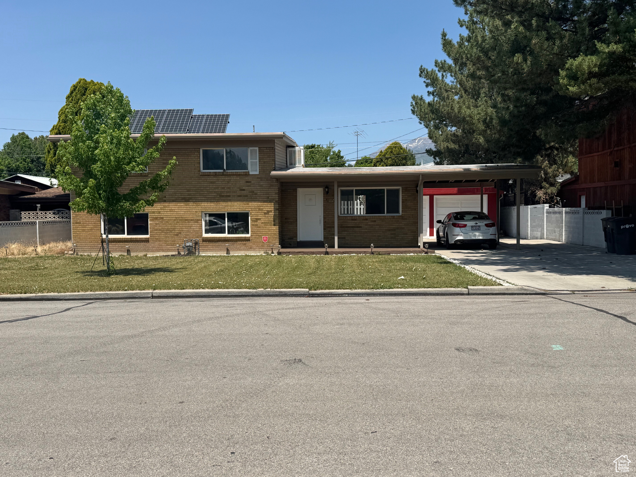 Worth a look! Great neighborhood, nice big yard, walking distance to parks and schools (about a mile walk from BYU) and easy access to freeway. New paint and carpet. It has a walk out basement with lots of light. Carport with RV parking alongside. 768 sq ft detached structure has 2 bdrm, 1full bath, could by used for home business (previously used as a preschool). The detached structure has been in place for about 30 years. The present owner finished the inside without city permit. Solar panels are included (fully paid). Buyer to verify the square footage. Please attach your bank's pre-approval letter with offer.