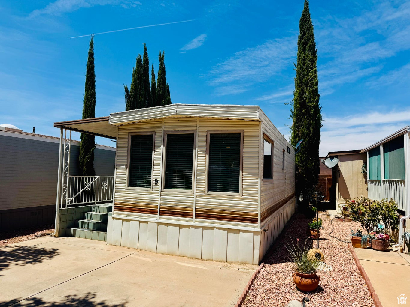 This darling 2-bedroom Park Model is exceptionally clean, bright, and ready for you to move right in and enjoy. The welcoming tiled deck sets the tone for relaxing mornings or evenings with friends. Inside, the bathroom has been tastefully updated, and the thoughtful layout offers comfort and functionality. The second bedroom features its own private entrance, perfect for guests or extended stays. Don't miss the chance to make this charming home yours! Buyer to verify all information.