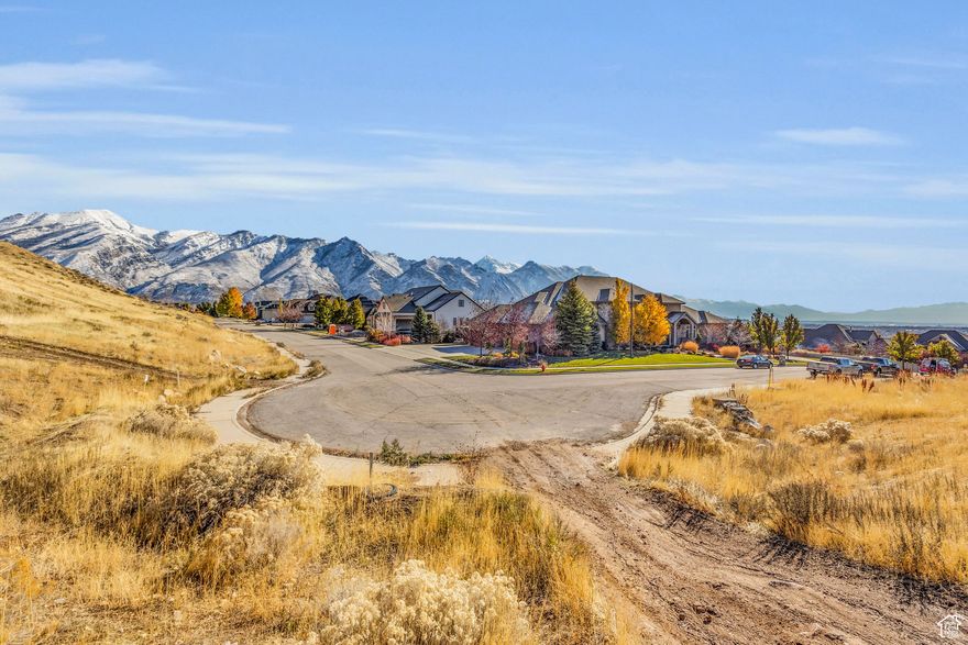 OPEN SPACE on all sides of this gorgeous Alpine Lot. This .61 acre lot perched at the top of a Multi-Million Dollar Neighborhood has Amazing Custom Build Potential. Choose your own Builder and Build your Dream Home!  The sweeping 360 degree views of the Wasatch Mountains, Utah Lake, Utah Valley and  American Fork Canyon are breathtaking.  The sunsets will blow you mind! This lot has direct access to mountain bike and hiking trails within the Corner Canyon Trail Network. HOA Free Lot. When looking at the lot please be aware the rocks on the property do not designate property line.  The property lines are well outside rock perimeter. All information and figures are provided as a courtesy. Buyer advised to verify all.