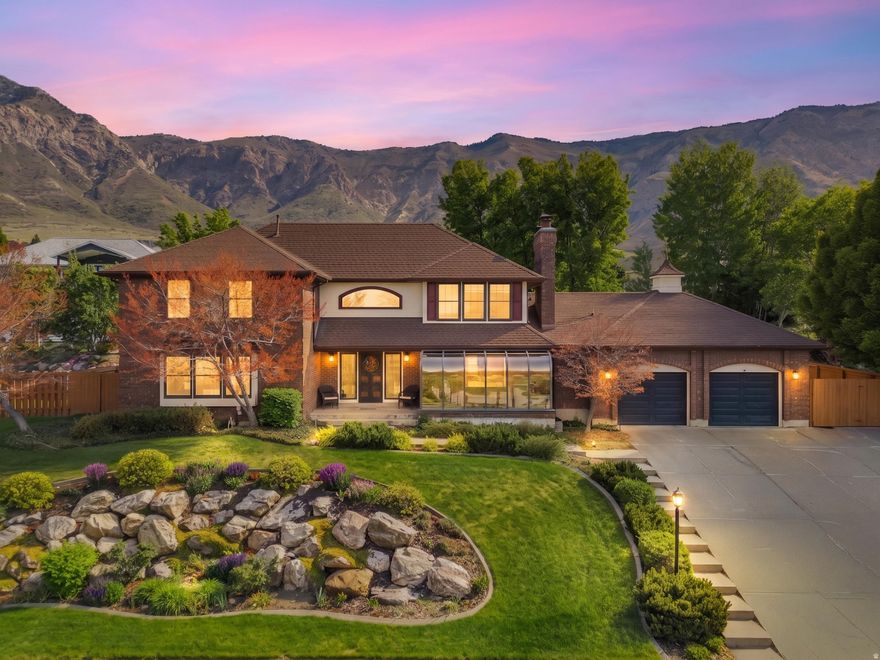 Timeless elegance meets unique character: Soaring curved walls, a grand curved staircase, and abundant natural light from skylights and the curved glass atrium windows create a dramatic yet welcoming flow throughout the home. Signature details: A stunning Venetian glass chandelier greets you in the entry, complemented by local artisan-crafted stained glass windows and rich wood flooring with high-end finishes. Generous, sun-filled spaces: Oversized rooms with thoughtful architectural touches like deep window seats invite relaxation and creativity. Private backyard oasis: A secluded fully fenced backyard with lush landscaping offers peaceful outdoor living, enhanced by a relaxing hot tub and breathtaking mountain and valley views. Chef-inspired kitchen: A dedicated pantry room, built-in wine fridge, and high-end finishes make entertaining effortless. Luxury primary suite: The grand main bathroom features custom finishes, dual sinks, and a spacious walk-in closet-your personal spa retreat. Storage & convenience galore: Extra-wide garage, abundant storage throughout, and a whole-house radon mitigation system for peace of mind. Move-in ready comfort: High-end finishes, wood floors, and thoughtful upgrades throughout ensure this home feels special from day one.