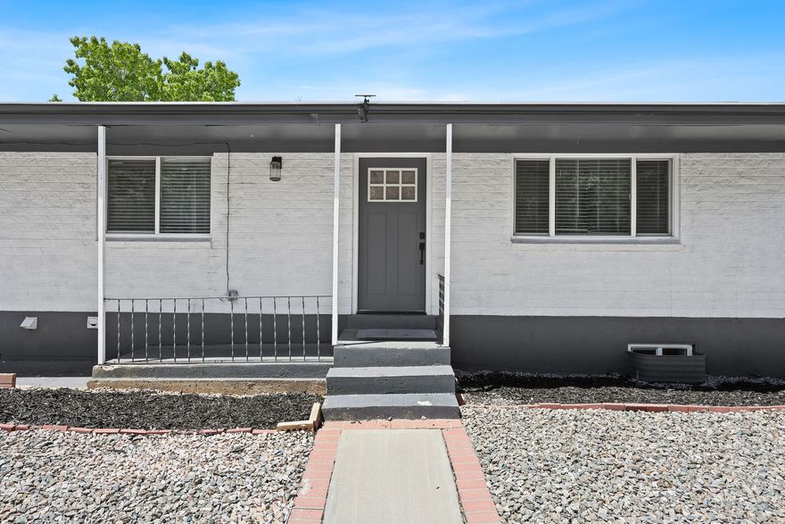 This beautiful rambler has been thoughtfully updated from top to bottom and offers a full walk-out mother-in-law basement-perfect for multi-generational living or potential rental income to help offset your mortgage. Inside, you'll find two stunning new kitchens featuring shaker cabinetry, quartz countertops, stainless steel appliances, stylish backsplashes, and modern finishes throughout. Premium waterproof LVP flooring flows through the main living areas, complemented by high-density carpet in the bedrooms and fresh interior paint throughout the home. Every bathroom has been tastefully updated with designer tile surrounds, modern vanities, and upgraded fixtures. Additional interior improvements include all-new craftsman-style doors, updated base and case trim, modern hardware, new exterior doors, and a beautiful double-swing French door leading from the basement walk-out. Major system upgrades provide peace of mind, including double-pane vinyl windows, new sewer main line, new roof, new plumbing, updated electrical with energy-efficient LED lighting, new outlets and switches, and a brand-new AC unit. Exterior enhancements include designer two-tone paint and seamless gutters surrounding the entire home. The spacious primary suite on the main level features a luxurious en-suite bathroom with a stunning tiled shower, double vanity, and separate walk-in closet. Separate laundry hookups are located both upstairs and downstairs, with basement laundry machines included. The tar and gravel roof has plenty of remaining life. Situated on a deep, oversized backyard, this home is ideally located near mountain access, hiking trailheads, local parks, Ogden Business Depot (BDO), and just minutes from Historic 25th Street dining and nightlife. World-class ski resorts are also within approximately 30 minutes, making this an exceptional opportunity to enjoy both convenience and outdoor recreation.   Square footage figures are provided as a courtesy estimate only, buyers to verify.