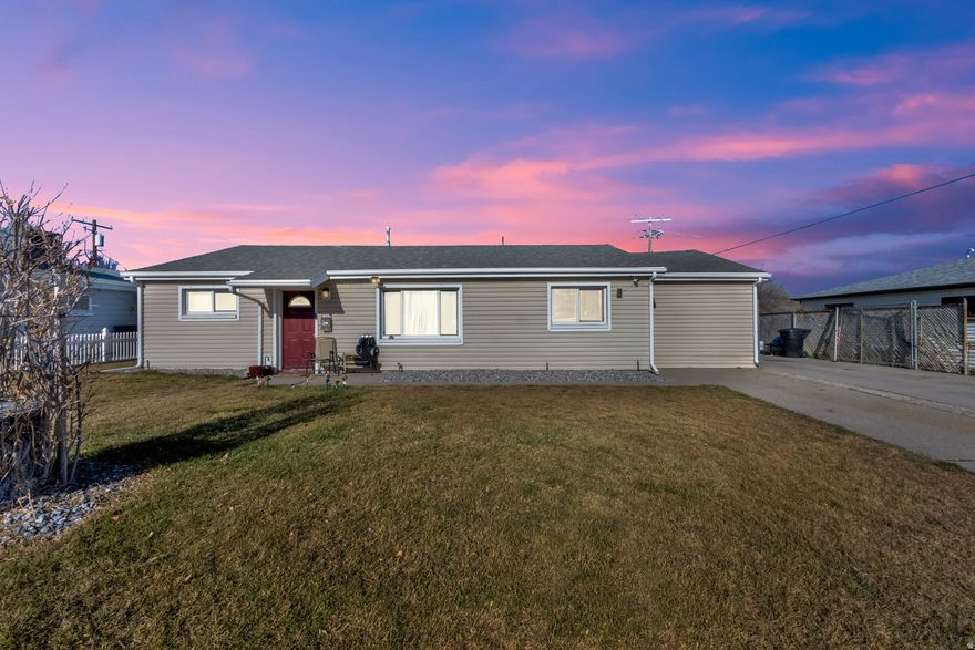 Located in a quiet Kearns neighborhood, this inviting rambler offers comfort, updates, and flexible living space. The home features 3 bedrooms and 1.5 bathrooms with a bright, open layout that feels both spacious and welcoming. A non-conforming fourth bedroom provides additional space ideal for an office, guest room, or personal retreat. Recent updates include newer laminate flooring throughout, updated windows, and newer siding and insulation, enhancing both efficiency and modern appeal. The generous lot includes RV parking and plenty of room to enjoy outdoor living. Come see it today!