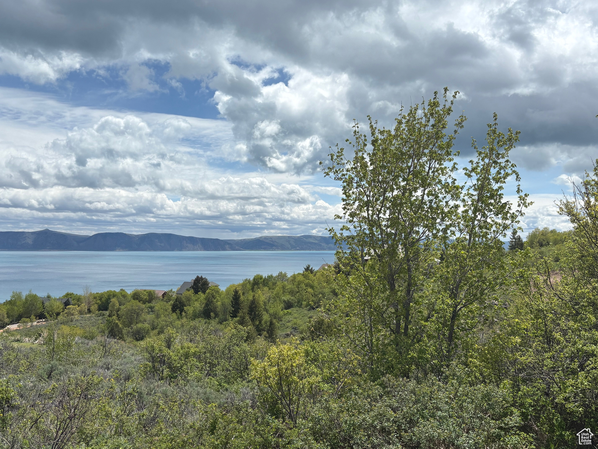 Beautiful views of Bear Lake, surrounding mountains and valley from this excellent, year round large corner building lot in Bear Lake West. Enjoy mesmerizing sunrises as well as sunsets, access to Bear Lake West beach, Bear Lake West Golf Course, Cooper's Restaurant and Sports Bar with outdoor patio, swimming pool/hot tub, tennis and pickleball court. Large common area/wildlife corridor to the south for protected views. . No short term rentals allowed.