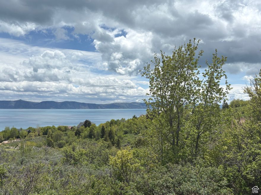 Beautiful  views of Bear Lake, surrounding mountains and valley from this excellent, year round large corner building lot in Bear Lake West. Enjoy mesmerizing sunrises as well as sunsets, access to Bear Lake West beach, Bear Lake West Golf Course, Cooper's Restaurant and Sports Bar with outdoor patio, swimming pool/hot tub, tennis and pickleball court.   Large common area/wildlife corridor to the south for protected views. . No short term rentals allowed.