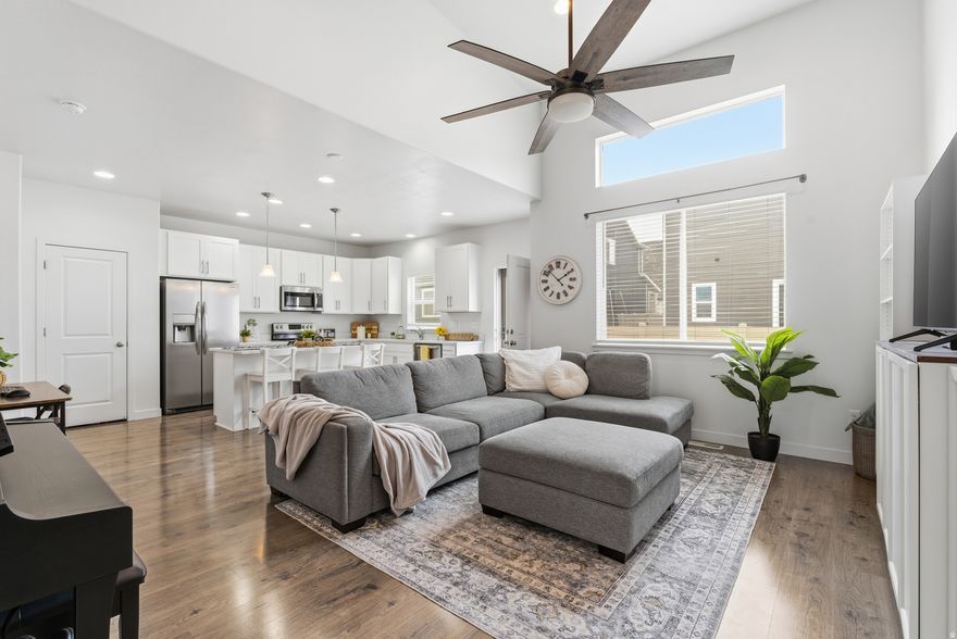 ***OPEN HOUSE Sat Feb 21, 11am-1pm*** Welcome Home! This immaculate, end-unit townhome in Eagle Mountain is waiting for you!  The main level features a gorgeous living room with soaring ceilings and so much natural light, a spacious kitchen with abundant cabinet space, a large center island that's perfect for gathering, and a convenient half bath for guests.   UPSTAIRS, escape to your primary suite, complete with convenient dual closets, a large bathroom, and plenty of space to relax! Two additional bedrooms filled with natural light, and another bathroom complete the upstairs space.  BASEMENT: The fully finished basement adds incredible versatility, offering a generous living room, an oversized full bathroom, and an additional bedroom featuring stylish barn doors-perfect for guests, a home office, or multi-generational living.  OUTSIDE: Enjoy the fully fenced backyard with patio space ideal for relaxing or entertaining. Enjoy the many parks and the community pool just down the street, and schools, restaurants, and shopping close by!  Don't miss this opportunity to own a move-in ready home in a thriving Eagle Mountain neighborhood-schedule your showing TODAY!