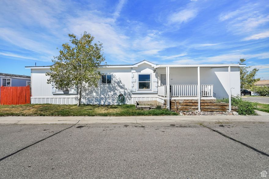 Discover a rare find in the Hacienda neighborhood of West Valley City-a spacious 1200 sq. ft. 16 ft wide single, larger than many in the community. This home offers 3 bedrooms and 2 bathrooms, providing plenty of room for comfortable living. Inside, you'll enjoy a functional kitchen and living room layout, while outside you'll find a fenced backyard for added privacy, a covered carport, and the bonus of being adjacent to the community clubhouse for easy access to neighborhood amenities. With its unique size and convenient location, this home is a great option for anyone looking for value and space in West Valley. HOA fee covers parcel rent and sewer and club amenities.