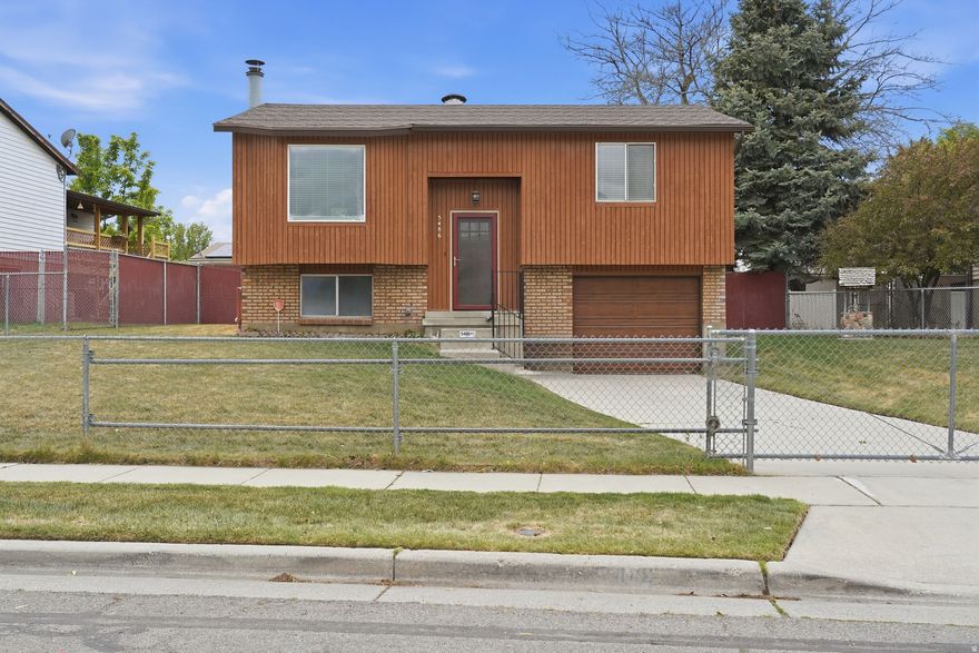 All new paint, flooring, baseboards and more! This turn key home is located near all amenities including minutes to both I-15 AND Bangerter Highway. A nice trex deck leads out to a fully fenced yard both front and back. The one car garage is extra deep with a storage closet in the garage.  Square footage figures are provided as a courtesy estimate only and were obtained from county records .  Buyer is advised to obtain an independent measurement.