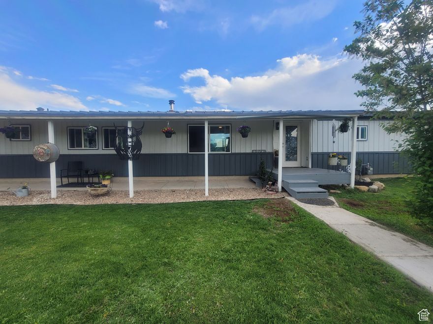 Country living on a corner lot with sheds, covered parking, and plenty of space for outdoor storage, including  a 30x60' open shed for parking RV, etc.  Large garden area with green house and raised garden boxes. Yard is fully fenced and ready for outdoor animals or family get togethers. Inside, the kitchen offers a peninsula bar to eat at and a split bedroom floorplan.