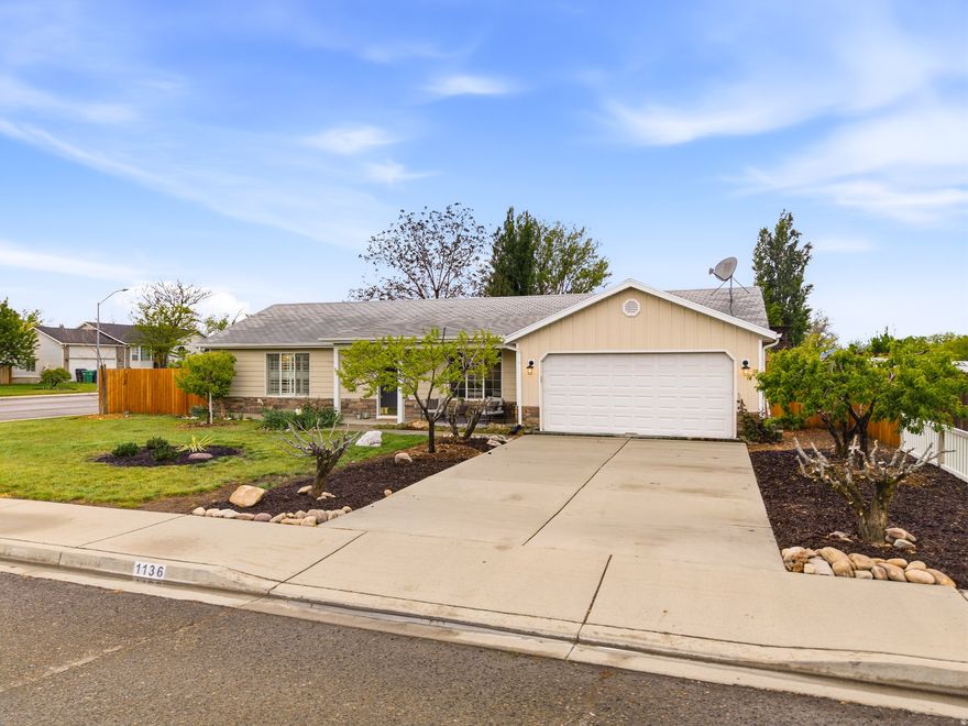 Open houses: Friday, 5/1/26 4pm to 7pm and Saturday, 11am2pm.  Pristine, move-in ready home in a coveted, family-friendly neighborhood where homes rarely come available. Lovingly maintained by the owners and professionally cleaned several times each month, this home truly shines. Fresh updates throughout include brand-new interior paint (walls and ceilings), new luxury vinyl plank flooring and carpet, an updated primary bathroom with a new shower and vanity, and most lighting fixtures thoughtfully upgraded. The kitchen has a new stainless steel dishwasher.  The exterior has just been enhanced with new siding and attractive stacked stone accents, adding to the home's curb appeal. Step into the spacious, fully fenced backyard featuring a newly built storage shed, an RV pad with in-ground sewer connection (at-home dump station), and rich, mulched soil ready for gardening. Enjoy an abundance of mature, fruit-bearing trees including peach, Asian pear, apricot, and apple, along with thriving raspberry and strawberry patches. A mature walnut tree provides excellent shade and a seasonal harvest perfect for baking. The extra-long two-car garage offers ample space for storage, tools, or a workshop, and includes a Tesla charger and new garage door opener. Beautiful views of the mountains enjoyed sitting on the front porch. This is a rare opportunity to own a beautifully updated home in a peaceful, established neighborhood with exceptional outdoor features and long-term neighborhood stability.   Listing agent is the owner.