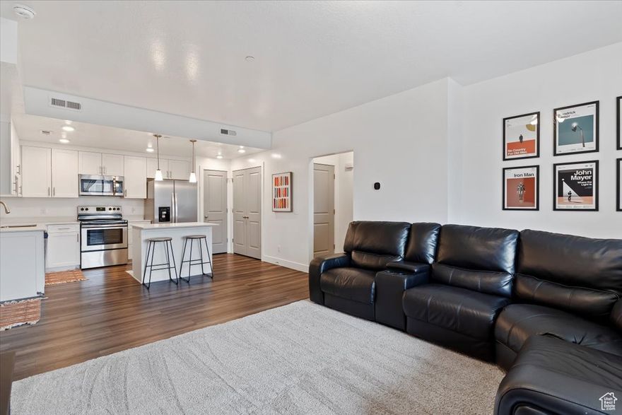 PRICE IMPROVEMENT, MOTIVATED SELLER! West Square is a great newer community. This home has been well kept, has great upgrades, as well as NEW CARPET throughout, and a private balcony. The neighborhood is less than one mile from the Front Runner Station, and just a few minutes to I 15. The condos amenities include: A Fully furnished club house, Swimming pool, Hot tub, BBQ area, Playground, and Dog park. Great BONUS the sellers are leaving the fridge, washer, and dryer.