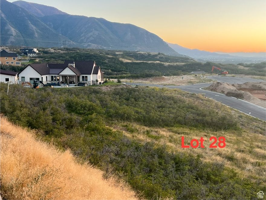 A majestic .46 acre mountain lot nestled up against the foothills of Maple Mountain. Highly sought after Hidden Hollow Cove subdivision in Mapleton, Utah. Super quiet, peaceful neighborhood, with no future backyard neighbors. Little to no traffic on this isolated loop road. Enjoy feeling very secluded, while only being 10-15 minutes from restaurants, stores, entertainment, outdoor recreation and quality schools. Beautiful panoramic views and stunning sunsets. Developed lot, ready to build on.