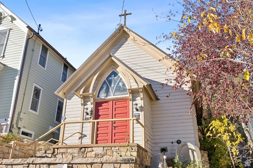 Standing proudly at 525 Park Avenue in the heart of Park City, this charming historic Episcopal church offers a truly extraordinary opportunity to own a piece of the town's spiritual heritage. The location is simply unmatched-just steps from Main Street's world-renowned dining, galleries, and boutiques, and mere minutes from some of the finest skiing in North America. This is the rare chance to acquire a property that combines historic significance with the ultimate in mountain town convenience.  This intimate building creates an atmosphere of peace and contemplation, with beautiful natural light filtering through its stunning stained glass windows. The vaulted ceilings naturally amplify sound reminding visitors of the generations who have gathered here, while the building's timeless character provides an inspiring canvas for whatever comes next.  The possibilities for this unique property are as varied as they are exciting. Whether you envision preserving this space for continued worship, transforming it into a distinctive residence unlike any other in Park City, creating an intimate venue for events and celebrations, or establishing a creative studio or gallery, the building's character and location make it ideal for adaptive reuse. The intimate scale and period details throughout offer both charm and flexibility, allowing a new owner to honor the building's heritage while reimagining its purpose for modern life.  Positioned on one of Park City's most coveted addresses, this property offers the perfect balance of accessibility and serenity. You can walk to everything that makes Park City special-the buzz of Main Street, acclaimed restaurants, and vibrant nightlife-yet return to a building that retains its contemplative, peaceful quality. The church rises as a quiet landmark in the neighborhood. This is more than a building-it's a piece of Park City's story, waiting to be cherished and thoughtfully reimagined for its next chapter.