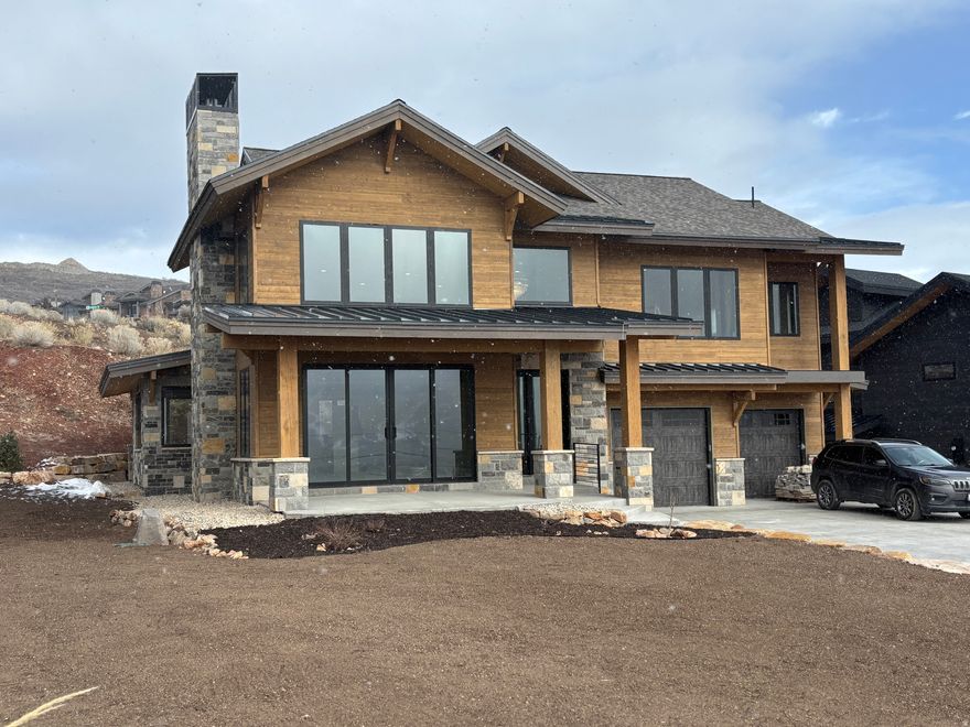 Nestled at the end of a peaceful cul-de-sac in the prestigious gated community of Reflection's Ridge in Hideout Canyon, this custom-designed new construction home offers a rare opportunity to create your dream retreat by selecting finishes that reflect your personal style. Perfectly positioned to capture breathtaking panoramas of the Jordanelle Reservoir and the majestic Deer Valley, every window frames a view that feels like art. Here, luxury meets outdoor adventure, with the vibrant charm of Park City just eight minutes away. Whether you're skiing at world-class resorts like Deer Valley and Park City Mountain, exploring Hideout's private trails, golfing on the scenic Outlaw course, or spending summer days on the waters of the Jordanelle, life in Hideout promises something extraordinary each day. Encompassing 2,500 acres of natural beauty, Hideout Canyon is a haven for outdoor enthusiasts who cherish space, quiet, and year-round recreation. This impeccably designed home embodies the spirit of this community-offering not only unparalleled views but also proximity to the finest outdoor and cultural activities in the region, from the Sundance Film Festival to endless hiking and biking trails. Whether you're drawn to its serene location, the chance to personalize every detail, or the lifestyle it affords, this home is your gateway to living at the intersection of luxury and nature's splendor. Don't miss the chance to make this stunning piece of Hideout yours and start every day with the world's best view right outside your window.