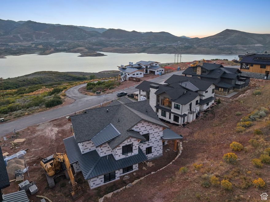 Nestled at the end of a peaceful cul-de-sac in the prestigious gated community of Reflection's Ridge in Hideout Canyon, this custom-designed new construction home offers a rare opportunity to create your dream retreat by selecting finishes that reflect your personal style. Perfectly positioned to capture breathtaking panoramas of the Jordanelle Reservoir and the majestic Deer Valley, every window frames a view that feels like art. Here, luxury meets outdoor adventure, with the vibrant charm of Park City just eight minutes away. Whether you're skiing at world-class resorts like Deer Valley and Park City Mountain, exploring Hideout's private trails, golfing on the scenic Outlaw course, or spending summer days on the waters of the Jordanelle, life in Hideout promises something extraordinary each day. Encompassing 2,500 acres of natural beauty, Hideout Canyon is a haven for outdoor enthusiasts who cherish space, quiet, and year-round recreation. This impeccably designed home embodies the spirit of this community-offering not only unparalleled views but also proximity to the finest outdoor and cultural activities in the region, from the Sundance Film Festival to endless hiking and biking trails. Whether you're drawn to its serene location, the chance to personalize every detail, or the lifestyle it affords, this home is your gateway to living at the intersection of luxury and nature's splendor. Don't miss the chance to make this stunning piece of Hideout yours and start every day with the world's best view right outside your window.