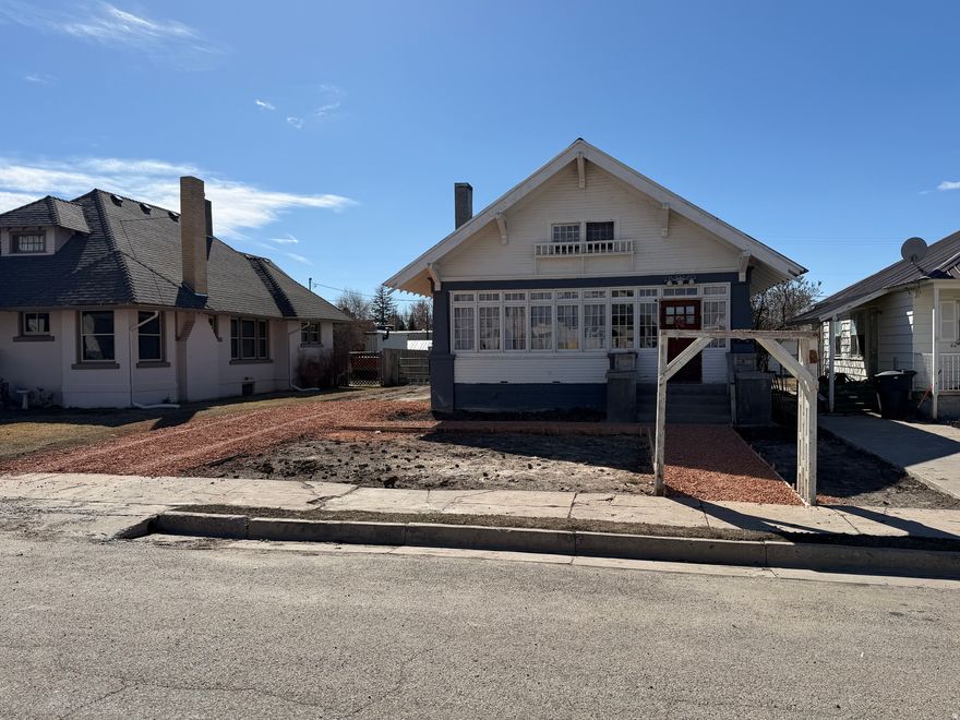 Updated home with lots of space, at a good price! Within last 5 years all new electrical, mostly all new plumbing, and super efficient boiler heating system! Front and back enclosed porches to enjoy peaceful mornings and evenings. High ceilings and open layout between living room, office, and dining, and beautiful kitchen! Recently refinished wood floors and new paint throughout! Large, good-looking bedrooms, with three walk-in closets. Convenient location to everything in town. Room to grow in basement, featuring new linoleum flooring, recently painted walls, and separate, functioning shower ready to be finished into 2nd bathroom! Very deep detached garage with power. New sod in the front yard to be installed before closing! Great parking in the back of the lot via alley access. This one won't last long! Square footage figures are provided as a courtesy estimate only and were obtained from county records. Buyer is advised to obtain an independent measurement.