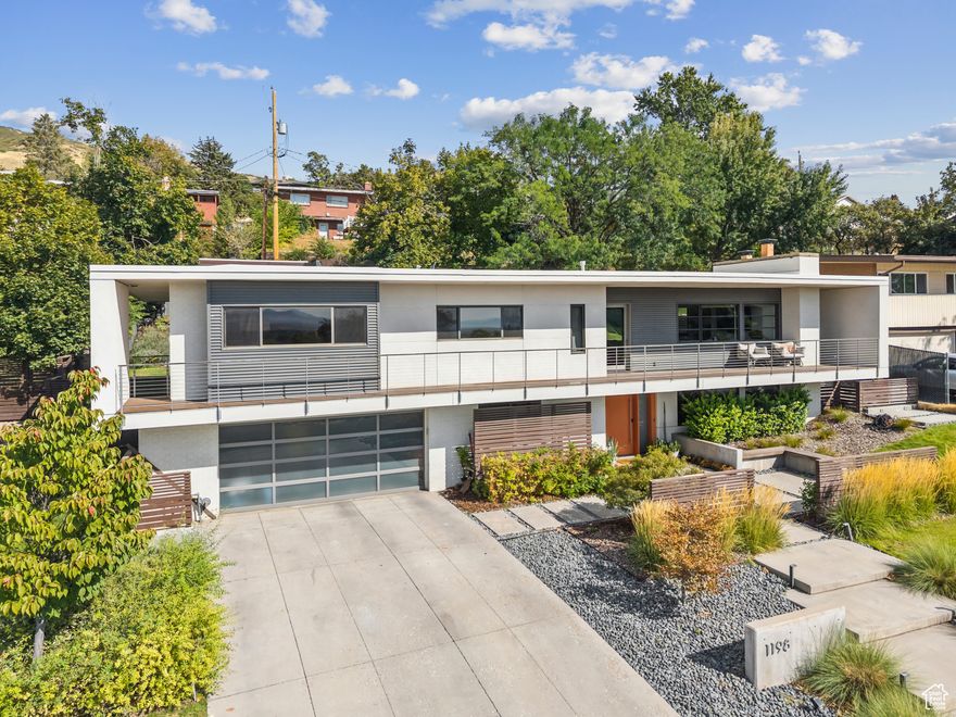 Experience refined living in this beautifully reimagined architect-designed residence nestled in the heart of Bountiful. This 4-bedroom, 3-bathroom home seamlessly blends contemporary elegance with thoughtful functionality, offering two expansive living areas ideal for both relaxing and entertaining. Originally redesigned by acclaimed architect Stephen Howard in 2016, the home's exterior showcases modern architectural elements and clean lines that elevate its curb appeal. In 20202021, the entire interior and landscaping were professionally and meticulously renovated, creating a truly turnkey property. Step into an open-concept interior boasting a chef-inspired kitchen, stylish great room, and luxuriously updated bedrooms and bathrooms. Every inch has been carefully curated with high-end finishes, premium fixtures, and custom design details. In the outdoor area, enjoy a container-style swimming pool, adjacent pool house and lounge area, and multiple outdoor gathering spaces - perfect for entertaining or unwinding in privacy. Architecturally designed concrete retention walls frame the landscape, complemented by custom walkways, staircases, and patios that guide you through the grounds. A concrete sport court with a basketball hoop adds a fun and functional element for recreation. Located just 10 minutes from I-15, and in close proximity to downtown Bountiful, Centerville, and miles of scenic hiking trails, this home offers the perfect balance of convenience and outdoor lifestyle.  Square footage figures are provided as a courtesy estimate only and were obtained from the county records.  Buyer is advised to obtain an independent measurement.