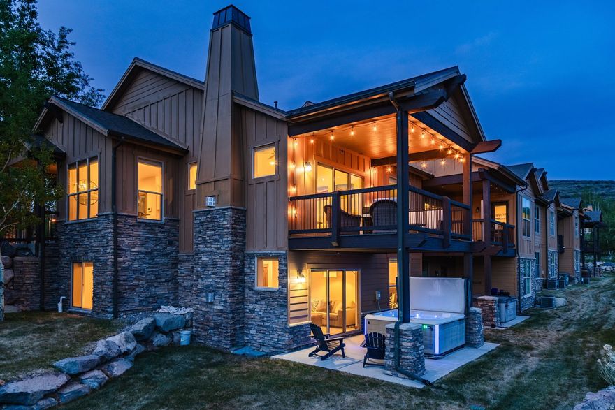 Stunning end-unit townhome with loads of natural light that combines comfort, convenience, and adventure in an exceptional mountain setting. Designed for easy main-level living with just one step from the spacious two-car garage to the open kitchen, living area with a cozy fireplace, spacious master suite, and an expansive deck for relaxing, barbequing, and taking in views of the Deer Valley and Park City ski areas. Downstairs, you'll find the ultimate gathering space with a huge home theater room (or bunk room) complete with a projector and full set of surround sound speakers. Beyond the theater room, you'll find a second primary suite, an additional bedroom, and a generous family room with a fireplace that opens to a patio complete with a large hot tub and beautifully landscaped backyard. Perfectly situated for an active lifestyle, this property offers quick access to scenic road & mountain biking routes, hiking trails, water recreation at Jordanelle Reservoir, and world-class skiing at Park City Mountain Resort and Deer Valley. Owners and guests also have the option to enjoy premium amenities at Black Rock Mountain Resort for an additional fee, including a heated outdoor pool, hot tub, spa, steam room, sauna, fitness center, public restaurant & bar, caf, shuttle service, and ice skating rinks. Whether you're searching for a full-time residence or vacation getaway, this Black Rock Ridge townhome delivers mountain living at its finest... If all that isn't enough, this home is only 10 minutes from the new Deer Valley East Village for ski access, 15 minutes to Park City Mountain Resort / Main Street, and only 35 minutes from the Salt Lake City International airport.
