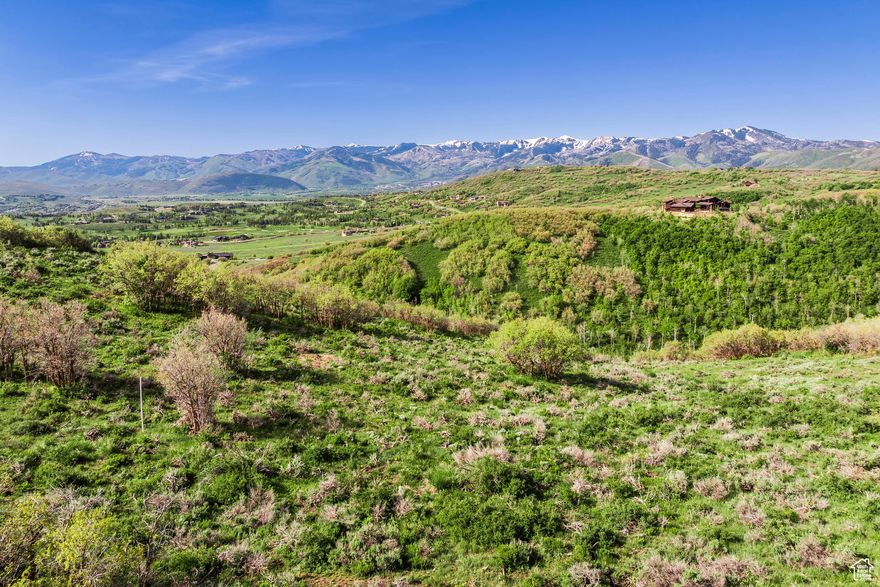 Discover the extraordinary potential of 976 W Deer Hill Drive-an expansive nearly 15-acre parcel nestled in The Preserve, one of Park City's most coveted private, gated communities. This rare homesite offers a once-in-a-lifetime opportunity to craft your dream estate-whether it's a serene primary residence or a luxurious vacation getaway in the heart of Utah's four-season playground. Set at the end of a peaceful cul-de-sac, the property boasts panoramic views that stretch from the snow-capped peaks of world-class ski resorts to the lush fairways of the exclusive Glenwild Golf Course, with the dramatic Uinta Mountain Range framing the horizon. Best of all, the homesite is strategically positioned to shield you from any visibility or noise from I-80 or Highway 40-offering total tranquility just minutes from town. The generous building envelope allows for an 8,000 sq ft main residence and an additional 2,500 sq ft guest home. Imagine waking up to the sight of elk and deer just beyond your window, stepping out your back door onto the Cobblestone Trail, and accessing the renowned Flying Dog and Glenwild Loop trail systems-right from your own backyard. Enjoy ultimate privacy while remaining just 10 minutes from the vibrant shops, restaurants, and conveniences of Kimball Junction, including Whole Foods. Located within the Park City School District and only 35 minutes from Salt Lake International Airport, this parcel is ideally situated for both everyday living and seasonal escapes. With the 2034 Winter Olympics on the horizon and Park City continuing to grow in prestige and popularity, there has never been a better time to invest in mountain luxury. Golf and social memberships at nearby Glenwild Golf Club & Spa offer resort-style amenities within moments of your future front door. Don't miss your chance to own one of Park City's most breathtaking blank canvases.