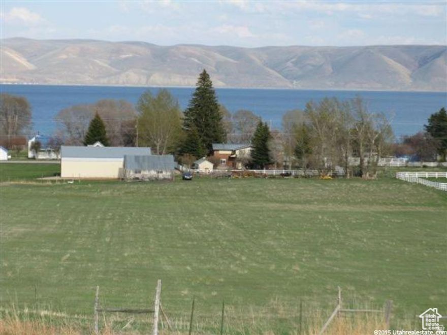 12.4 ACRES Bear LAKE & MOUNTAIN VIEWS.  Remodeled Country Home w/enclosed porch. *45x72 CLEARY Building w/power, with 12x42 over- hang and 12x24 enclosed garage. *16x30 SHOP w/Power. *24x32 RUSTIC OLD BARN. *11-acre fenced FIELD w/17X40 DECK & FIRE PIT along the CANAL. *13.5-shares irrigation WATER SHARES. *5-RV Hook-Ups with water/sewer! Perfect FAMILY RETREAT, horse property, mini-farm, or possible subdivision in quaint/quiet FISH HAVEN. Access to FOREST for ATV/Groomed SNOW TRAILS. Bear Lake State Park MARINA or North Beach State Park 9 miles.
