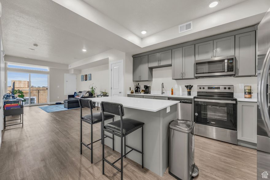 ***VA assumable loan at 5.99%*** This beautifully maintained 1-bedroom with an office/den for an optional 2nd bedroom, 1-bathroom condo offers modern living with stunning mountain views from the fourth floor. This 753 sq. ft. unit features an open floor plan, perfect for comfortable living. The bright living room boasts sliding glass doors that lead to a walk-out balcony, ideal for enjoying the scenic views. The kitchen is complete with quartz countertops, shaker-style cabinets, and a convenient pantry for additional storage. Enjoy access to on-site amenities, including a fully equipped gym, and take advantage of the condo's prime location near shopping, schools, Hill Air Force Base, and easy freeway access. Square footage figures are provided as a courtesy estimate only and were obtained from County records. Buyer is advised to obtain an independent measurement.
