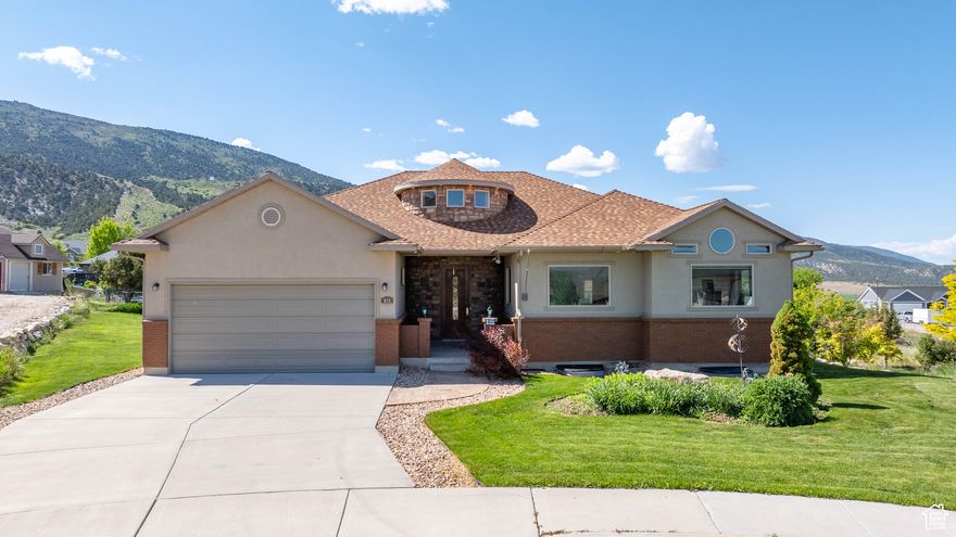 This beautiful home is located in a quiet cul-de-sac in an upscale neighborhood and is just minutes away from Ephraim Canyon and Bald Mountain where you'll find scenic access to trails and breathtaking views!  You will be captivated as you enter a stunning, round tower front entry with soaring 16-foot ceilings. The bright, inviting kitchen is equipped with a large island, granite counters, pantry and large picture windows to unobstructed views of the mountains. The main suite features a large walk-in closet, spacious bathroom with large soaking tub, a roomy walk-in tiled shower with dual shower heads and windows to let in plenty of natural light. There are two additional large bedrooms and another full bathroom allowing for ample living space. The main floor laundry area includes a utility sink and a wall of custom cabinetry. The large, unfinished basement is designed for three additional bedrooms, large common area and another full bathroom. This fully landscaped home sits on one-third of an acre lot and has a 980 square foot garden enclosed with deer fencing, brick fire pit, apple and pear trees and a covered porch to sit and enjoy the views of the mountains and valley. Schedule your showing today!  EXTRA'S: Brand new carpet throughout the house, two water heaters and gas fireplace.