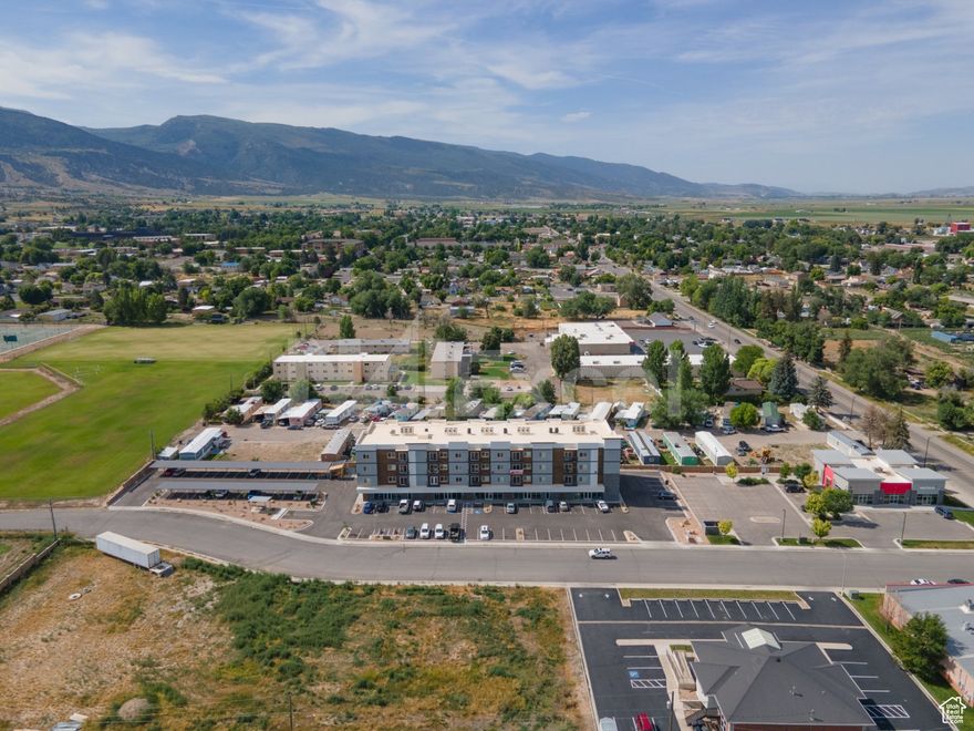 **Exceptional Investment Opportunity in the Heart of Ephraim**  We are pleased to present a unique investment opportunity in the charming agricultural community of Ephraim, where picturesque rural scenery harmonizes with contemporary living. This impressive property features robust steel framing, ensuring unmatched durability and security seldom found in the area.  Comprising five commercial retail spaces alongside thirty upscale residential units, this property is meticulously designed to accommodate a diverse range of lifestyles and investment strategies. The residential offerings include:  - **Six spacious 3-bedroom, 2-bathroom units** (1280 sq. ft) - **Six cozy 2-bedroom, 2-bathroom units** (1195 sq. ft) - **Eighteen elegant 1-bedroom, 1.5-bathroom units** (875 sq. ft)  Each residence showcases modern interior design combined with superior insulation, providing residents with an exceptional standard of comfort and aesthetic appeal. Conveniently located, the property is within proximity to a variety of amenities, including numerous dining establishments, shopping centers, and the esteemed Snow College. Furthermore, an upcoming hospital enhances the area's potential for continued growth and accessibility, making this location an ideal investment. Experience the perfect balance of serenity and convenience in this idyllic setting. Whether you are a discerning investor or seeking to establish a beautiful home, do not miss this rare opportunity.  Transform your vision into reality-contact us today for further information and to arrange a personal viewing!