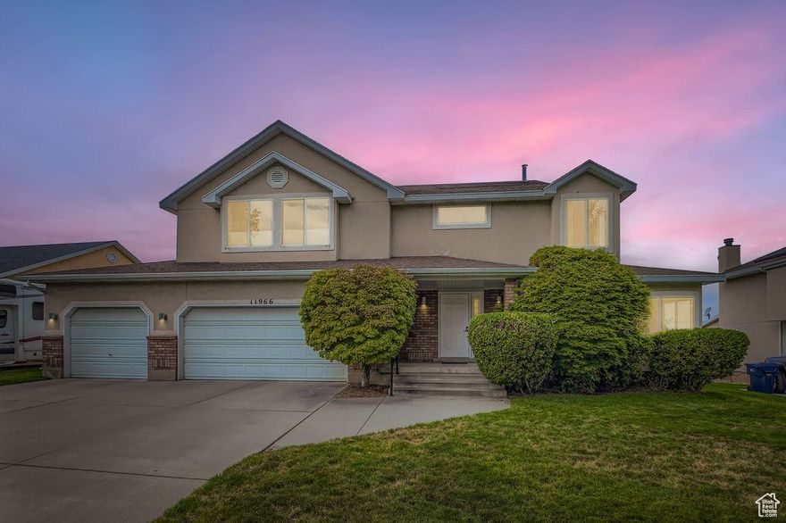 11966 S BLUFF VIEW DRIVE -  A Home Too Refined for Ordinary Buyers. This residence isn't for everyone. In fact most buyers will find it far too much. The sweeping valley views from nearly every window will distract you endlessly. You'll never get anything done with sunsets like that. The cherry hardwood floor, too rich, too warm, to be enjoyed by anyone that doesn't recognize that elegance underfoot sets the tone for the entire home. Even the spa-like bathroom with it's soaking tub and bespoke finishes are completely unnecessary unless you enjoy relaxing in luxury. Before considering this home, ask yourself, "Do I enjoy starting my day scraping ice off the car on a perfectly chilled January morning in Utah?", if the answer is yes, then the oversized three car garage with room for all, might not be for you. Subtle sophistication and discreet luxury, like cork flooring in the master bath and triple-pane windows in the primary suite, add quiet comfort and efficiency that ordinary buyers might not even notice. So this is not a home for the casual or the indifferent. It requires a buyer with discernment, someone who recognizes that a refined space is an essential element of a life well lived. This is a home for those with taste and elegance and the means to appreciate if fully.