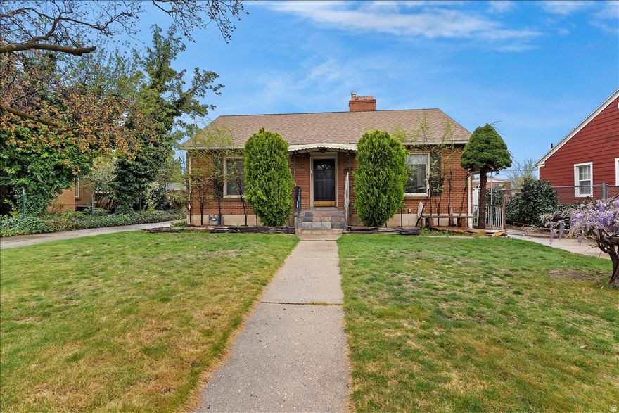 Beautiful brick rambler in a prime Bountiful location offering built-in flexibility and income potential with a fully updated basement apartment featuring a full kitchen, separate entrance and private driveway. This well-maintained home showcases original hardwood floors, with modern upgrades including updated bathrooms and kitchens, new light fixtures, custom built-ins, and a cozy fireplace. The spacious lot provides ample room to enjoy with RV parking, a large detached 2-car garage, and additional off-street parking. Ideal for house hacking, multi-generational living, or investors looking for rental income, all while being conveniently located near shopping, dining, parks, and quick access to I-15 for an easy commute to Salt Lake City or Hill AFB.