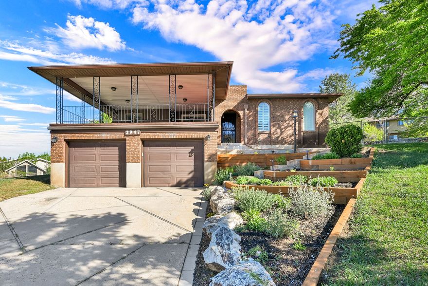 Located high on the sought-after North Ogden bench, this exceptional home offers breathtaking panoramic valley and mountain views, incredible outdoor living spaces, and easy access to nearby trailheads and year-round recreation. The showstopping covered deck off the main living area and great room is truly one of the home's standout features - thoughtfully designed for entertaining and perfectly positioned to take in the spectacular views. A second deck and patio create even more space to relax and enjoy the setting. Inside, the spacious layout includes an expansive kitchen that opens to the great room and deck, making the main level ideal for gatherings. Features include skylights, unique architectural details, two gas fireplaces, a walk-out basement, central vac, and wiring for an emergency generator. Recent updates include a new roof in 2022, replaced north and south windows, new stainless steel appliances, new ceiling fans, water heater, water softener, interior paint, updated hardware and finishes, and shutters in the primary bedroom. Outside, you'll also appreciate the terraced landscaping, replaced retaining walls, full automatic sprinklers, and secondary water.