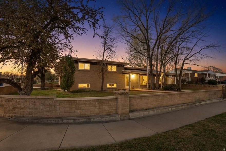 Priced at the average price per square foot for the area, BUT nothing is average about this Home. Mid-century modern. All-brick. Thoughtfully updated while honoring its original character. Rich hardwood floors. Beautifully preserved wallpaper. Rare sense of authenticity and timeless charm. Vaulted great room. Natural light. Warm, inviting space to gather, dine, and entertain-anchored by a classic wood-burning fireplace. Fully fenced backyard designed for connection and relaxation. Stamped concrete patio for alfresco dining. Water feature with goldfish. Additional covered patio/carport provides flexible space for entertaining, toy parking, or outdoor living. Most garages simply store cars-this one is built for enthusiasts. Expansive 28' x 25.5' garage includes a mechanic's pit, creating a truly unique and functional workspace. Extensive updates include a newer roof, windows, HVAC with zone thermostats, paint, lights, LVP flooring, along with refinished original hardwoods. Kitchen's solid wood cabinetry is enhanced with custom roll-out shelving for everyday ease. Home has added character with a dutch door, french doors that fully open to enhance indoor-outdoor living, and a shower/ toilet room that even has a urinal. Basement 2 is all storage with shelves and cabinets. Wood burning fireplace has a gas stub-out for easy conversion. There is a dog area/run on the south side of the garage that just needs a gate added. Square footage provided as a courtesy from county records; buyer to verify.