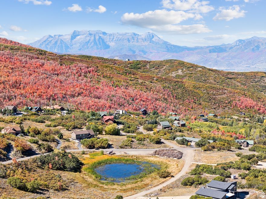 Welcome to your future mountain retreat in the gated community of Timber Lakes, just 15-20 minutes from the upcoming Deer Valley East Village and 7 miles east of Heber City, Utah. This prime 1.30-acre corner lot is only a short drive from the main Timber Lakes gate and provides direct access to the Wasatch backcountry in minutes. Featuring gentle slopes, mature aspens, and a serene natural setting, this lot offers the perfect canvas for your dream mountain chalet, luxury cabin, or year-round getaway. Whether you're looking to build, invest, or simply enjoy nature, the location is ideal for outdoor lovers-snowmobiling, hiking, mountain biking, ATVing, and wildlife viewing are right at your doorstep. Timber Lakes is a private, year-round gated community with maintained roads, mountain views, and close access to world-class skiing, fishing, and boating at nearby reservoirs like the Jordanelle and Strawberry. View the property video here:https://youtu.be/imADmo_FwBo