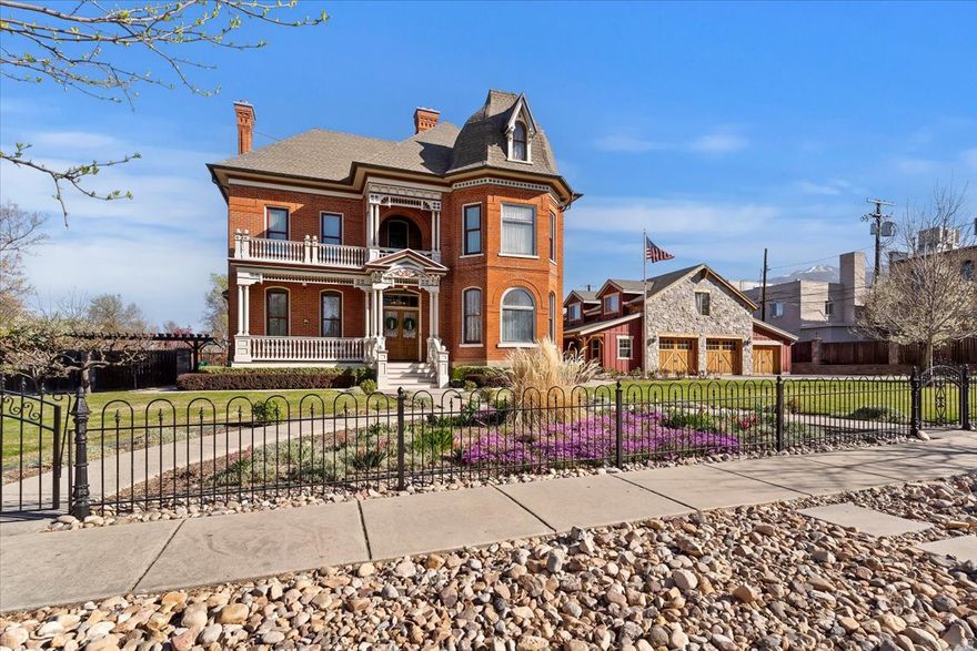 CLICK THE "TOUR" FOR CINEMATIC VIDEO. Step into a remarkable piece of Kaysville's rich heritage with the historic John G.M. Barnes House-an elegant late-19th-century residence that seamlessly blends architectural distinction with deep local significance. Originally constructed in 1884 and thoughtfully expanded in 1896, this striking brick home showcases refined Victorian design, attributed to noted local architect William Allen. While rich in history, the home offers the comfort and functionality of a well-loved and thoughtfully updated family residence. Extensive renovations have been completed in accordance with historic preservation standards approved by the Utah State Historic Preservation Office, ensuring authenticity while enhancing livability. Recent improvements include updated plumbing and electrical systems, significant masonry restoration, all seven chimneys rebuilt, and a new roof complemented by copper gutters, scupper boxes, and downspouts on both the home and garage. Inside, meticulous preservation continues with stunning hand screen-printed wallpaper from the renowned Bradbury & Bradbury studio-materials that are no longer available-adding to the home's rare and irreplaceable character. In addition to the main residence, the property features a spacious detached garage with workshop and storage, epoxy floors, and a fully equipped apartment or additional living space complete with a kitchen, bathroom, laundry & separate office or studio- this addition is ideal for guests, extended family, or potential rental income. Step outside to a thoughtfully designed outdoor living area perfect for entertaining, featuring an outdoor kitchen, pizza oven, fireplace, garden boxes, swing set, and a private patio retreat. Nestled in the heart of Kaysville's historic district, this exceptional property is just steps from downtown shopping, dining, parks, and entertainment, as well as top-rated Davis County schools, including Davis High School. This is more than a home-it's a rare opportunity to own a true landmark property where timeless design meets meaningful history  Square footage figures are provided as a courtesy estimate only and were obtained from appraiser measurement .  Buyer is advised to obtain an independent measurement.