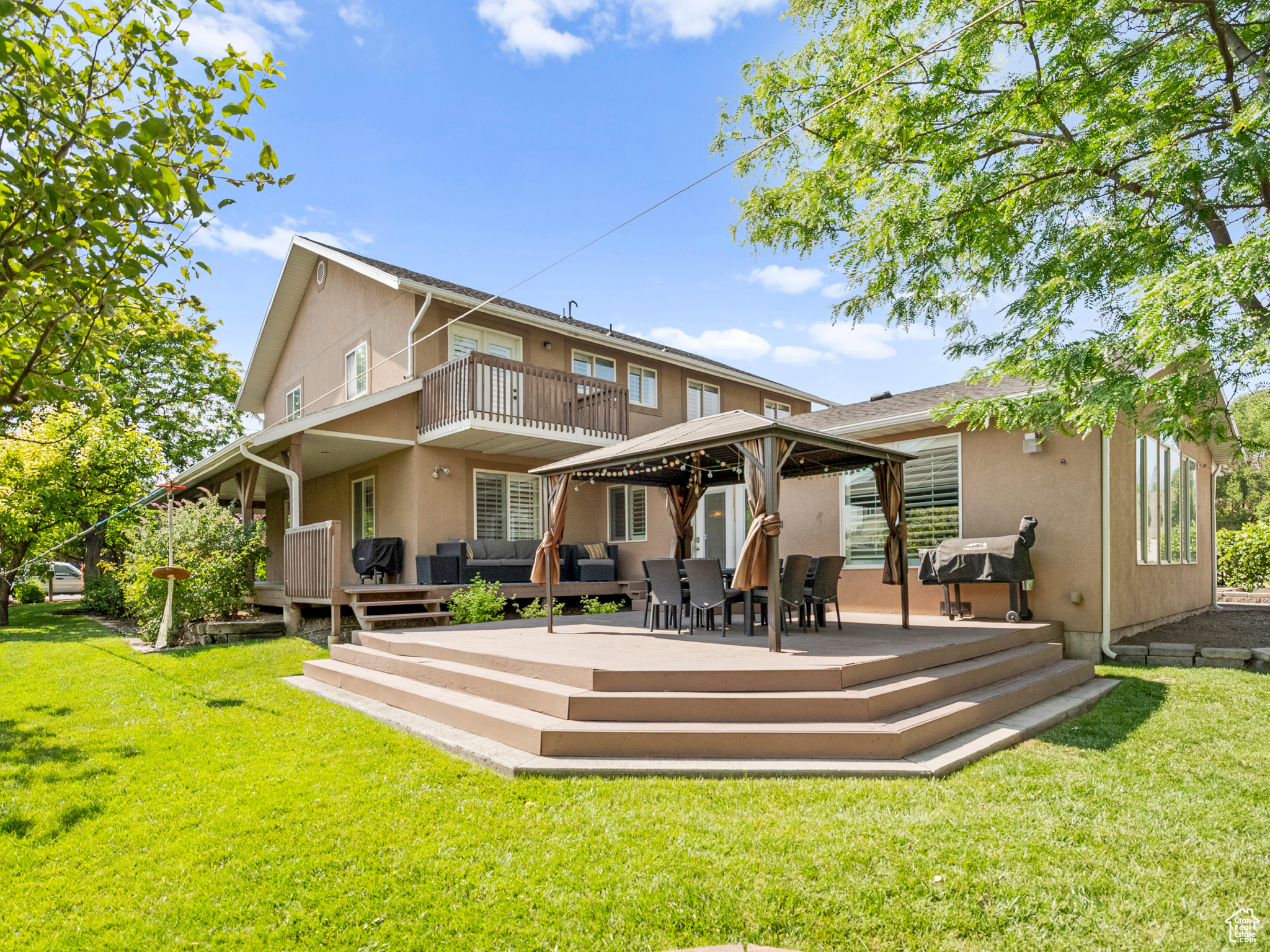 This single-family home is a hidden gem in this booming area of Pleasant Grove. Step into the backyard and you're in your own shaded oasis full of mature fruit trees, raspberries, garden space, greenhouse and a small vineyard. It is a kids' dream house with a gymnastics-level trampoline, treehouse and zip line, complete with gazebo making it perfect for hosting barbecues. The 25x30 shop and side RV pad are great for hobbies and/or toys and bikes. The extra long garage boasts more storage with shelving and a separate cold-storage room while fitting two cars comfortably. The interior features 6 bedrooms, 3.5 bathrooms, including a master suite, an office, mud room, and an XL family room with gas fireplace. The spacious, updated kitchen and dining room are perfect for any gathering. Custom built-ins and wall features throughout give this home a comfortable and modern feel with plenty of storage. Only 5 mins from I-15 and State Street, it is in a prime location to access anything you need.