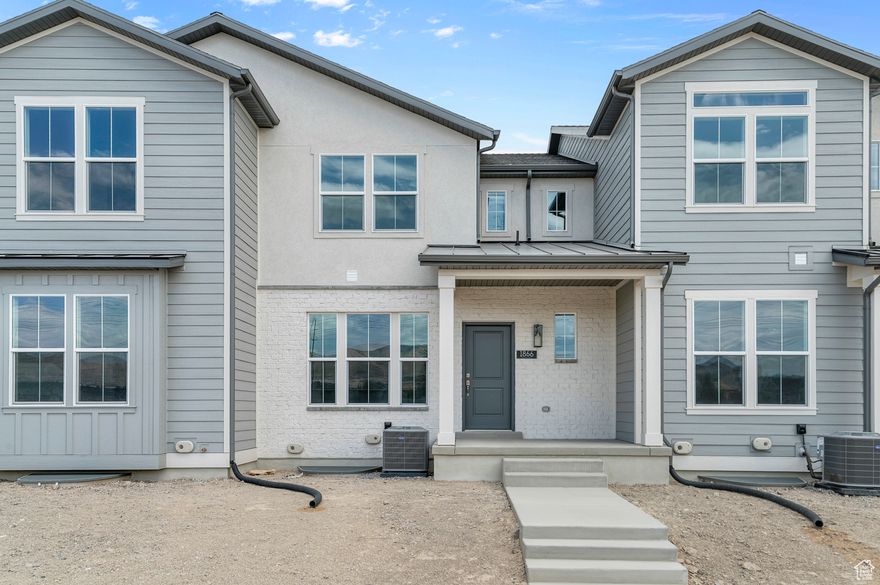 Experience stylish living in this Bellevue Town Home in a great Lehi community! This home features gray laminate cabinets, sleek quartz countertops, and stainless steel gas appliances. Durable laminate hardwood, vinyl tile, and carpet flooring offer the perfect balance of comfort and durability. Designed with energy efficiency in mind, this home includes a tankless water heater and thoughtful modern finishes such as Craftsman-style base and casing. The owner's bathroom offers a serene escape with cultured marble shower surrounds and elegant satin & brushed nickel hardware. Smart, stylish, and move-in ready-this home combines function and design in a desirable townhome layout.