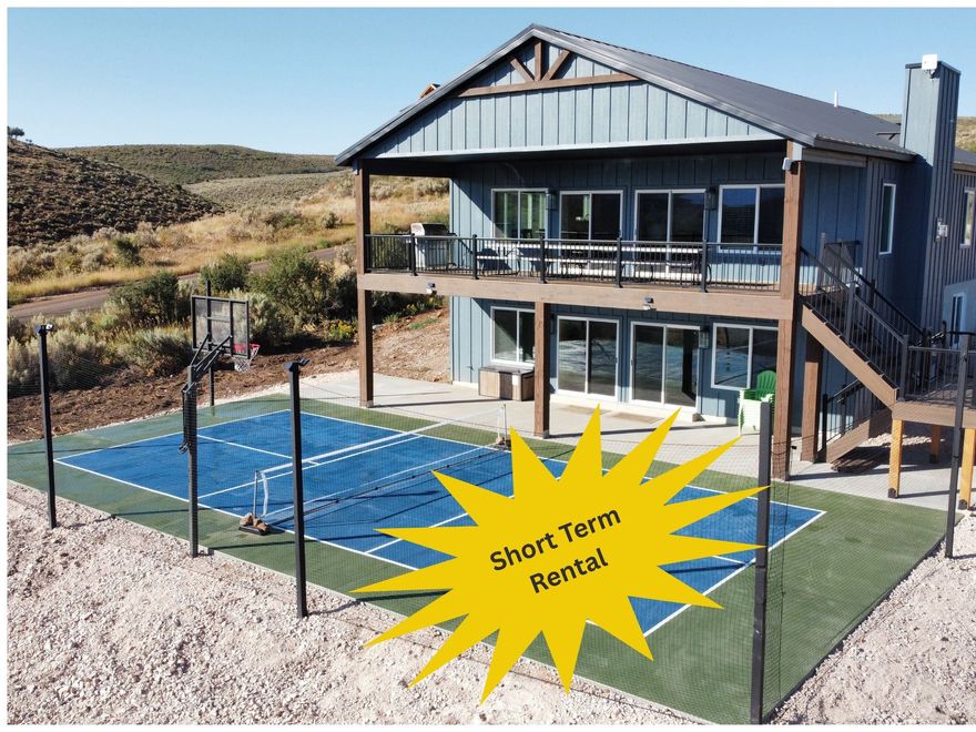 Sold fully furnished!! Ideal Beach Resort access available at $1950 per year (already paid through June 2026). Exceptional brand-new 7-bedroom, 4-bath turnkey short-term rental with luxury finishes throughout! Highlights include quartz countertops, custom cabinetry, a standing seam metal roof, LP SmartSide siding, Trex deck, and 2 fifty-gallon water heaters. Outdoors, enjoy a huge deck and patio, pickleball court, basketball hoop, custom gaga ball pit, and tons of parking. The home also features a 1,000-gallon underground propane tank for efficiency. Fully furnished with all 5-star reviews and over 50 nights already booked for 2026, this property offers immediate income potential and the perfect blend of style, comfort, and entertainment.