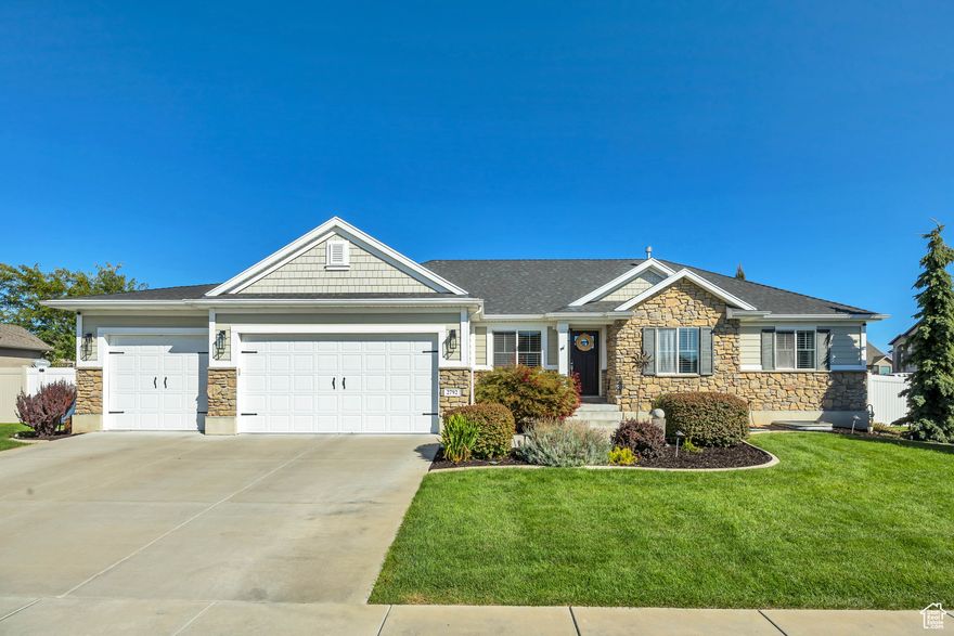 *** Back on the market as Buyer's Financing didn't come together so this STUNNING property is available once again *** Welcome to this immaculate 3,231square-foot home in West Point, Utah, boasting a prime corner lot with stunning landscaping, mature trees, and breathtaking mountain views. This 6-bedroom, 3-bathroom residence features an updated kitchen with double oven, granite countertops, and an open floor plan perfect for entertaining. Enjoy the cozy ambiance created by the beautiful kitchen, gas fireplace and vaulted ceilings. Additional highlights include main level laundry, central air, a smart thermostat, humidifier, and a 4-car garage with ample storage space. The yard is equipped with auto sprinklers and a drip irrigation system. This smart home is powered by Samsung Smart Things, offering security features such as window and door sensors, leak sensors, video doorbell, and more. Outdoor amenities include an exterior gas line for a fire pit and grill, as well as outdoor speaker readiness under the incredible covered deck, that also has lighting and a ceiling fan built in where entertaining can continue. A network switch and smart hub are included for your convenience.  *TV mounts, speakers, curtain rods and curtains excluded*  Don't miss the opportunity to MAKE THIS YOUR DREAM HOME!!! Buyers are advised to obtain an independent measurement and verify all information provided.