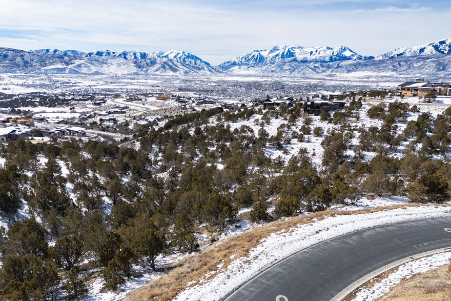 From sunrise to sunset, enjoy sweeping views across the Heber Valley, the iconic backdrop of Mount Timpanogos, and the waters of Deer Creek Reservoir - from 2714 E. La Sal Peak Drive - a setting that truly defines mountain living.  Set within the private, golf-oriented community of Red Ledges, this homesite invites a custom design that embraces indoor-outdoor living. The downhill orientation is ideal for walk-out lower levels, expansive decks, and walls of glass that frame the scenery and bring the outdoors in. Whether it's morning coffee overlooking the valley or evenings spent watching the lights of the Valley below, this is a place designed to slow down and savor the surroundings.  Enjoy the privacy of a larger lot while remaining just minutes from everything that makes the area so special - championship golf, world-class skiing, blue-ribbon fly fishing, and easy access to the shops, dining and charm of Heber, Midway, and Park City.  A full Golf Membership to the Red Ledges Club is available, offering access to the Jack Nicklaus Signature Golf Course and Golf Park, state-of-the-art fitness and wellness facilities, pools, tennis, pickleball, and daily shuttles to the new Deer Valley East Village, where our members enjoy three on mountain amenities. This homesite delivers the perfect balance of views, privacy, and lifestyle - an opportunity to create a home and enjoy the mountain life at its very best.