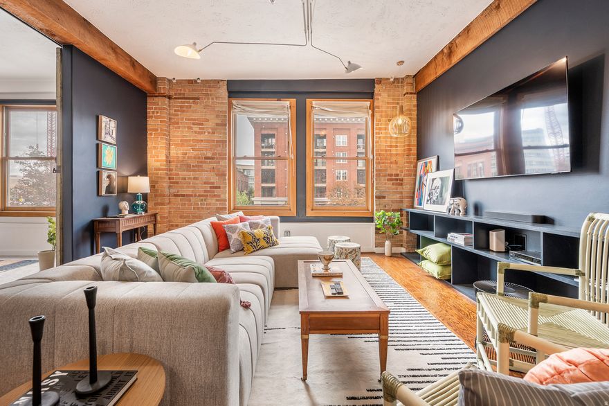 This is one of two beautifully-designed, front-facing units offered for sale by the owner in one of Salt Lake City's most unique loft buildings. A rare opportunity to purchase one loft or both, to combine, creating a large one-of-a-kind space in the heart of the city (with board approval, see MLS 2137217). The pet-friendly Warehouse District condo building is a warehouse-to-condo conversation in the city's lively Gateway District. Just outside the door are some of the city's best restaurants, bars, theaters and shops. Walk to The Rose Establishment for coffee, Caputo's for lunch, or Chile-Tepin for dinner. Floor-to-ceiling exposed brick, large timber beams, wood windows, and vintage metal sliding doors make this loft feel warm and authentic. The space has been redesigned with an updated kitchen, custom shelving, gorgeous new bathroom, and a new furnace. Includes one parking space inside the secure gate, and in-unit washer & dryer. All this, just 10 minutes from the new Salt Lake International Airport. Truly a must-see property.