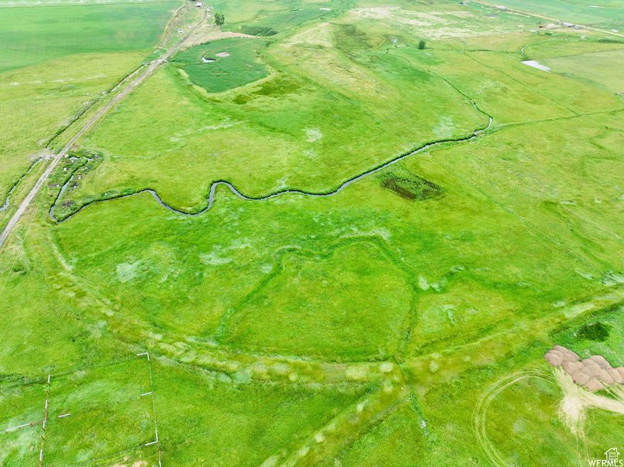 65 acres of beautiful farm or development land in Paris Idaho. Land has been split and approved for 13 different lots or keep it as one whole piece! City utilities available but need to be ran to split the land. 23.55 irrigation shares included in sale.