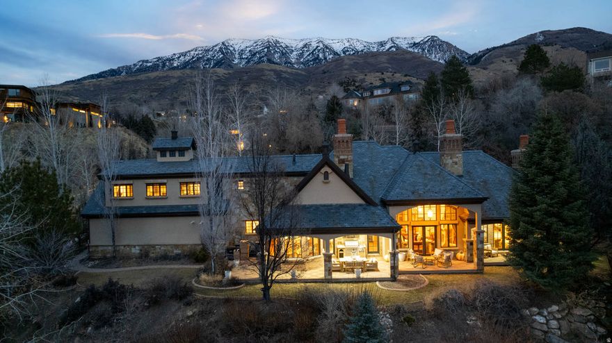 This home has everything you're looking for, and VALUE! You'll be hard pressed to find a home with finishes this elevated. The exposed joists in the ceiling make this large family room feel absolutely expansive and the views will leave you in awe. Custom countertops throughout the home add to the depth and personality of the home and are sure to be a talking point to all your guests! The heated driveway will retire your snowblower for good!  This home has Charm that you just can't find in the newer construction cookie cutter.  This home will be perfect for hosting parties ( whether inside or out on the covered patio) with phenomenal views of the valley and Utah lake. This home also offers seclusion and serenity with the waterfall and yard surrounded by woods if parties aren't your thing and privacy is a concern. Square footage figures are provided as a courtesy estimate only and were obtained from County Records.  Buyer is advised to obtain an independent measurement. * SELLER TO PROVIDE BUYER WITH A 5 DAY 4 NIGHT CRUISE FOR TWO UPON SUCCESSFUL CLOSING**