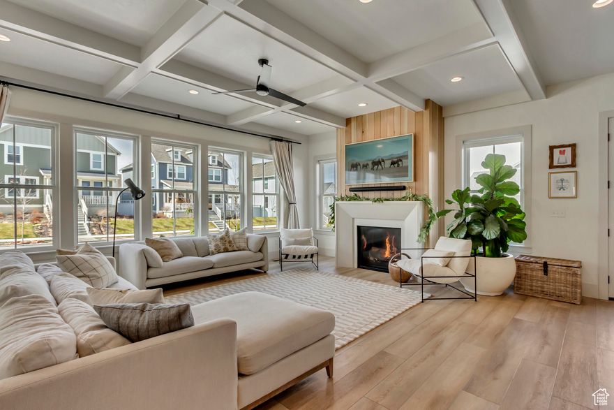 This exceptional 4-bedroom, 3-bathroom home sits on a spacious .20-acre corner lot in one of Daybreak's most desirable locations-directly across from Pennant Park and just one block from the Watercourse. Designed with both luxury and lifestyle in mind, this property is filled with thoughtful upgrades and high-end features throughout.     Interior Features: Gourmet kitchen with premium Monogram appliances  Slide-in 8-burner range with griddleBuilt-in full-size refrigerator & freezer Butler's pantry with inset cabinetry, microwave, open shelving, and recessed lightingCoffered ceilings in entry and family roomGrand primary suite with spa-style bath, dual shower heads, soaking tub, and dual walk-in closets Finished basement with 10-ft ceilings, custom gym, kids' playhouse, and lap-wood accent wall     Exterior & Systems:Massive 4-car garage with 240V EV outletSoft water system, dual water heaters, dual furnacesUpgraded farmhouse-style gutters and metal porch covering Wrap-around porch adds charm and curb appeal Beneath the porch: 10-foot deep cold storage for seasonal gear, tools, and more In-ground trampoline for fun and function  Smart Home Features: Smart lighting, fireplace, garage, sprinklers, garden drip linesSecurity cameras and Eufy doorbell Interior & exterior speaker system     This home blends timeless style with cutting-edge convenience-all set in an unbeatable location close to trails, parks, and amenities.   A true showstopper that won't last long.  Schedule your private showing today!