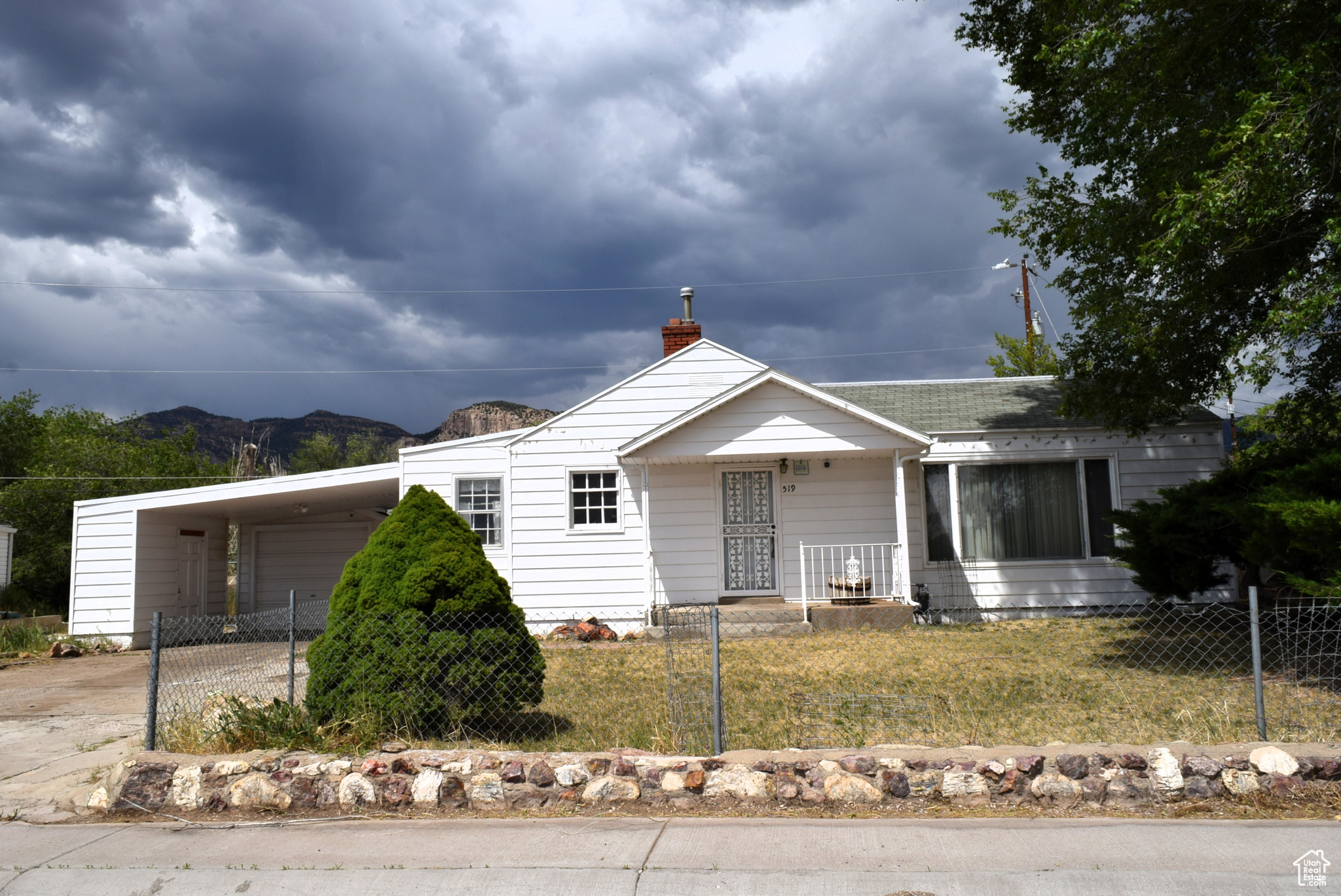 Here's your chance to transform this 3-bedroom, 1.75-bathroom house into the home of your dreams. This property boasts an array of desirable features that provide a fantastic foundation for a stunning remodel. Enjoy the grandeur of vaulted ceilings and a spacious floor plan. The living room features a magnificent stone fireplace with matching stone flooring. Beyond the aesthetics, functionality is key with a carport and 1-car garage, including a dedicated space for a small workbench, ideal for projects or storage. Tax ID 1C-0651-0001 is included. Square footage figures are provided as a courtesy estimate only. Buyer is advised to obtain an independent measurement.