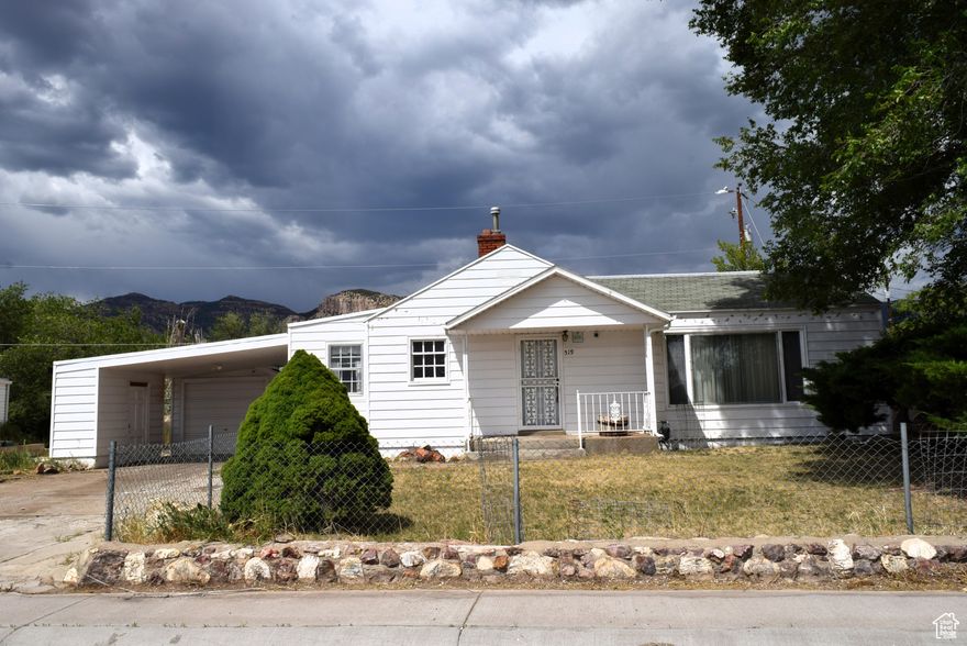 Here's your chance to transform this 3-bedroom, 1.75-bathroom house into the home of your dreams. This property boasts an array of desirable features that provide a fantastic foundation for a stunning remodel. Enjoy the grandeur of vaulted ceilings and a spacious floor plan. The living room features a magnificent stone fireplace with matching stone flooring. Beyond the aesthetics, functionality is key with a carport and 1-car garage, including a dedicated space for a small workbench, ideal for projects or storage. Tax ID 1C-0651-0001 is included.  Square footage figures are provided as a courtesy estimate only. Buyer is advised to obtain an independent measurement.
