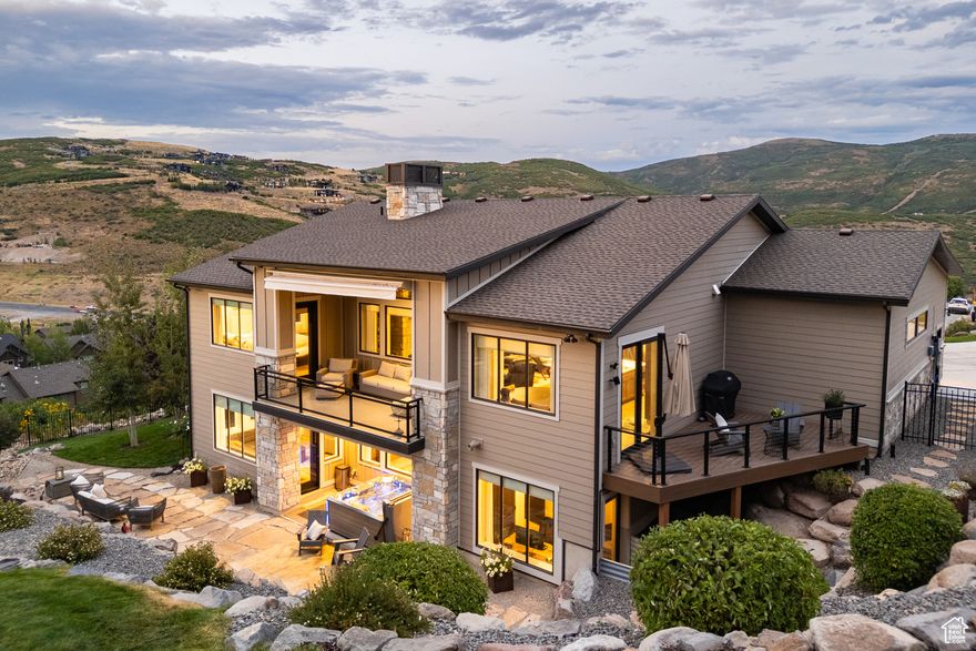 Tucked at the end of a quiet cul-de-sac, this updated 2018-built home offers the perfect mix of modern style, comfort, and family-friendly living. With hardwood floors throughout and soaring 12' ceilings in the great room, the open-concept layout is both warm and spacious-ideal for everyday life and family gatherings.  The main-level primary suite offers privacy and comfort, while the oversized 3-car garage-with extra height-has plenty of room for bikes, skis, tools, toys, and vehicles. Numerous thoughtful upgrades by the current owner mean this home is truly move-in ready.  Downstairs, the finished lower level includes a large second living area and full wet bar-perfect for movie nights, game-day fun, or a teen hangout space. It's the kind of flexible area every family needs.  Step outside to a fully fenced and landscaped .39-acre yard-ideal for kids, pets, and backyard play. Whether it's summer barbecues, autumn evenings around a firepit, or soaking in the hot tub after a snow day, the yard is ready for four seasons of fun. Mature trees offer shade and privacy, while the open space gives everyone room to roam.  With nightly rentals allowed, the home also offers flexibility for second-home use or rental income potential-great for families who travel or want extra options.  Located just 10 minutes to East Village at Deer Valley and Park City's Main Street, and only 30 minutes to Salt Lake City International Airport, this home gives your family easy access to skiing, hiking, biking, and award-winning schools-plus the peace and space of a quiet neighborhood.  This is mountain living made easy, stylish, and family-ready.