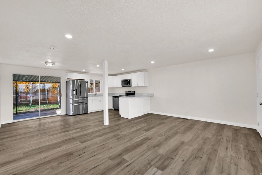 NEW NEW NEW and ready for you. New HVAC, New Kitchen with granite countertops and stainless steel appliances, including range, microwave, and refrigerator.  All new lighting, paint, flooring, and completely remodeled bathrooms. Featuring 3 bedrooms and 2 bathrooms, this charming property offers modern updates, comfortable living, and a fantastic location close to schools, parks, and local amenities.  Step inside to discover a fresh and inviting interior that's been recently updated throughout, giving you the comfort and feel of a brand-new home. The spacious living area is perfect for relaxing or entertaining, while the remodeled kitchen shines with modern finishes, new fixtures, and ample cabinet space.  Enjoy peace of mind with a brand-new HVAC system delivering year-round comfort and energy efficiency. The home also includes a carport.  Outside, the fully fenced backyard is ready for gatherings with family and friends. Whether you're hosting a summer BBQ, letting the kids play, or unwinding on a quiet evening under the Utah sky, this outdoor space is perfect for enjoying all seasons.  Don't miss your chance to own this darling remodeled home that perfectly combines modern updates with classic comfort. Call today to schedule your private showing and make this Sunset gem yours!  (Buyer and buyer's agent to verify all information.)