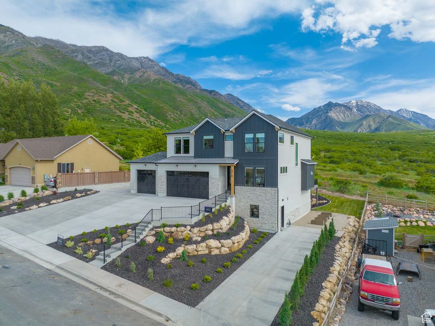 2022 Judges Choice Awarding Winning Utah Valley Parade Home. This home is a MUST see with the breath taking views. Designed to maximize views of the east bench and valley. Upgraded Quartz and Granite countertops with a waterfall edge kitchen island. Upgraded Cafe appliances. Surround sound system throughout. Motorized shades on main level. Beautifully crafted custom beams in living room as well as custom beam work in master.Tile master shower with bench and euro door. Stunning hardwood floors. 3 car garage with epoxy floors, RV parking, close to I-15 access & more! Buyer/Buyers Agent to verify info.